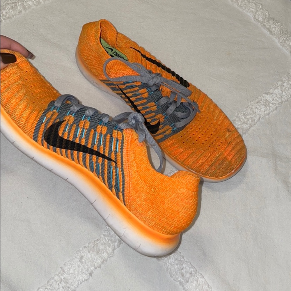 Orange Nike React Flyknits